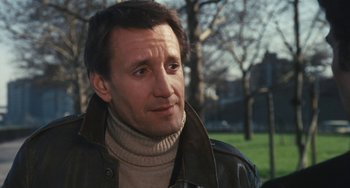 Movie still from “The Seven-Ups” (1973), directed by Philip D'Antoni – A person wearing a jacket; Close Up shot, Low angle