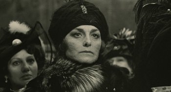 Movie still from “The Ship Sails On” (1983), directed by Federico Fellini – An old photo of a woman in a fur coat and a hat; Close Up shot, Low angle