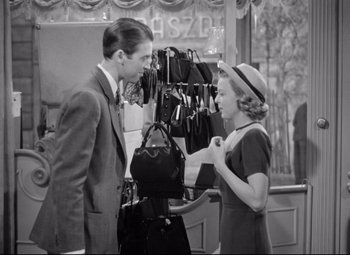 Movie still from “The Shop Around the Corner” (1940), directed by Ernst Lubitsch – A man and a woman looking at each other in a store; Medium shot, High angle