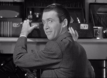 Movie still from “The Shop Around the Corner” (1940), directed by Ernst Lubitsch – A black and white photo of a man in a suit; Close Up shot, Over the shoulder angle