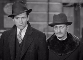 Movie still from “The Shop Around the Corner” (1940), directed by Ernst Lubitsch – A couple of men standing next to each other wearing hats; Close Up shot, High angle