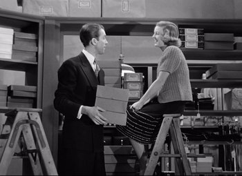 Movie still from “The Shop Around the Corner” (1940), directed by Ernst Lubitsch – A man and a woman are talking in a room; Medium shot, Low angle