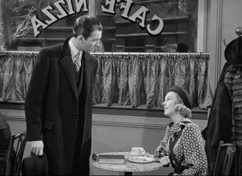 Movie still from “The Shop Around the Corner” (1940), directed by Ernst Lubitsch – A man and a woman sitting at a table in a restaurant; Medium shot, Over the shoulder angle