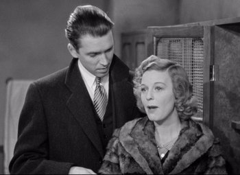 Movie still from “The Shop Around the Corner” (1940), directed by Ernst Lubitsch – An older man standing next to an older woman; Medium shot, Low angle