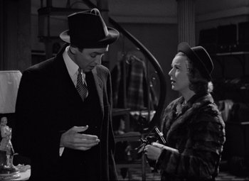 Movie still from “The Shop Around the Corner” (1940), directed by Ernst Lubitsch – A man and a woman talking to each other; Medium shot, Over the shoulder angle