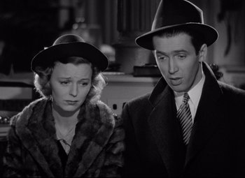 Movie still from “The Shop Around the Corner” (1940), directed by Ernst Lubitsch – A man and a woman wearing hats and fur coats; Close Up shot, Low angle