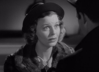 Movie still from “The Shop Around the Corner” (1940), directed by Ernst Lubitsch – A woman wearing a hat and a fur coat; Close Up shot, Over the shoulder angle