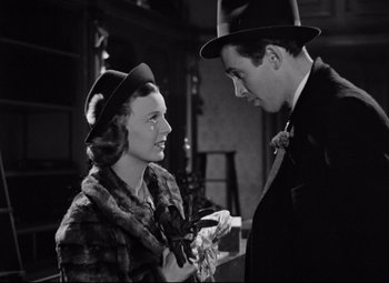 Movie still from “The Shop Around the Corner” (1940), directed by Ernst Lubitsch – A man and a woman wearing hats and fur; Medium shot, Low angle