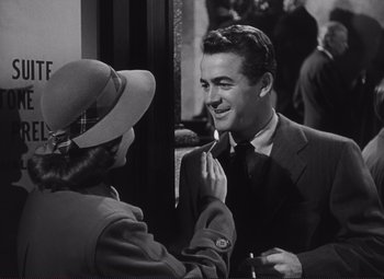 Movie still from “The Snake Pit” (1948), directed by Anatole Litvak – A man and a woman talking to each other in front of a mirror; Medium shot, Over the shoulder angle