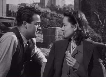 Movie still from “The Snake Pit” (1948), directed by Anatole Litvak – A man and a woman talking to each other; Medium shot, High angle
