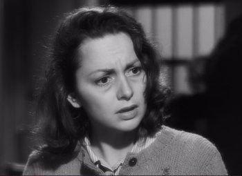 Movie still from “The Snake Pit” (1948), directed by Anatole Litvak – A black - and - white photo of a woman looking at the camera; Close Up shot, High angle