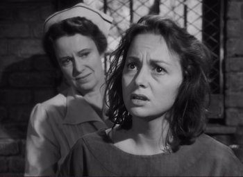 Movie still from “The Snake Pit” (1948), directed by Anatole Litvak – Two women are standing next to each other; Close Up shot, Over the shoulder angle