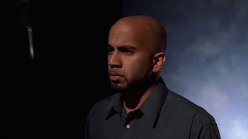 Movie still from “The Sopranos” (1999), created by David Chase – A man with a bald head is standing in a dark room; Close Up shot, Low angle