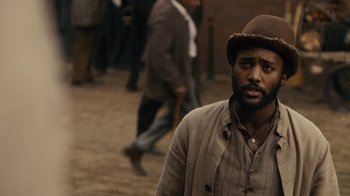 Movie still from “Anne with an E” (2017), created by Moira Walley-Beckett – A man with a beard wearing a brown hat; Close Up shot, Over the shoulder angle