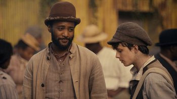 Movie still from “Anne with an E” (2017), created by Moira Walley-Beckett – A man and a boy wearing hats talking to each other; Close Up shot, Over the shoulder angle