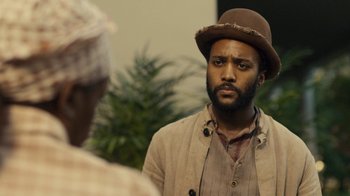 Movie still from “Anne with an E” (2017), created by Moira Walley-Beckett – A man wearing a brown hat and a brown jacket; Close Up shot, Over the shoulder angle