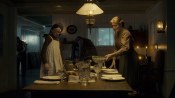 Movie still from “Anne with an E” (2017), created by Moira Walley-Beckett – Two women prepare a meal at a dinner table; Medium shot, Low angle