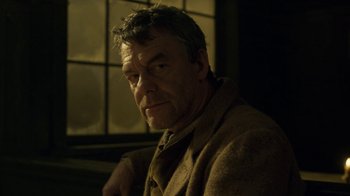 Movie still from “Anne with an E” (2017), created by Moira Walley-Beckett – A person sitting in a room; Close Up shot, Low angle