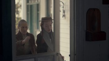 Movie still from “Anne with an E” (2017), created by Moira Walley-Beckett – Two women are looking in a mirror; Medium shot, Over the shoulder angle