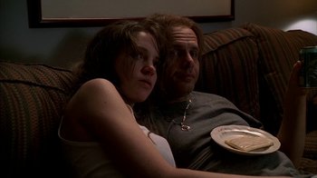 Movie still from “The Sopranos” (1999), created by David Chase – A man and a woman sitting on a couch; Medium shot, Low angle