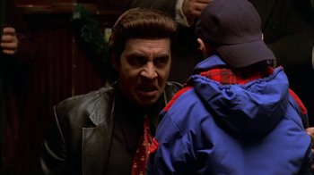 Movie still from “The Sopranos” (1999), created by David Chase – A man in a jacket and a tie talking to a young boy; Close Up shot, Over the shoulder angle