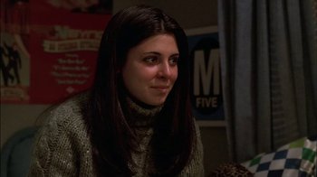 Movie still from “The Sopranos” (1999), created by David Chase – A woman with long dark brown hair sitting in a room; Close Up shot, Low angle