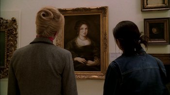 Movie still from “The Sopranos” (1999), created by David Chase – Two women looking at a painting in a museum; Close Up shot, Over the shoulder angle