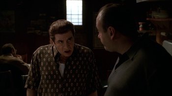 Movie still from “The Sopranos” (1999), created by David Chase – A man and a woman talking to each other; Medium shot, Over the shoulder angle