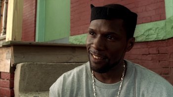 Movie still from “The Sopranos” (1999), created by David Chase – A person wearing a hat; Close Up shot, Over the shoulder angle