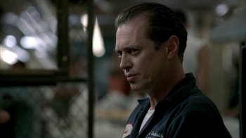 Movie still from “The Sopranos” (1999), created by David Chase – A person wearing a black shirt; Close Up shot, Low angle