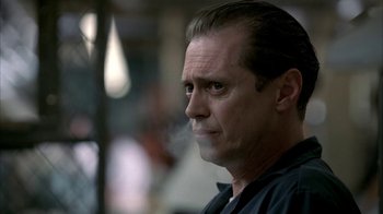 Movie still from “The Sopranos” (1999), created by David Chase – A person with a cigarette in his mouth; Close Up shot, Low angle