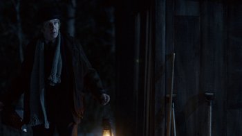 Movie still from “Anne with an E” (2017), created by Moira Walley-Beckett – An old man holding a lantern in the dark; Medium shot, Over the shoulder angle
