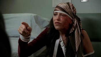 Movie still from “The Sopranos” (1999), created by David Chase – A woman with a bandanna on her head; Close Up shot, Over the shoulder angle