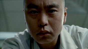 Movie still from “The Sopranos” (1999), created by David Chase – A person wearing a lab coat; Extreme Close Up shot, Low angle