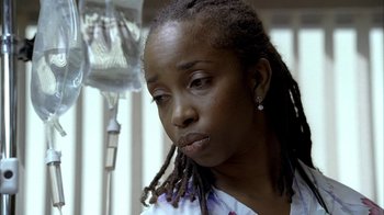 Movie still from “The Sopranos” (1999), created by David Chase – A person with dreads; Close Up shot, High angle