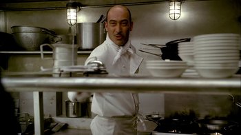 Movie still from “The Sopranos” (1999), created by David Chase – A man standing in front of a counter in a kitchen; Close Up shot, Low angle