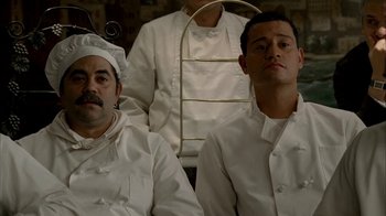 Movie still from “The Sopranos” (1999), created by David Chase – A group of men in chef's outfits sitting next to each other; Medium shot, Low angle