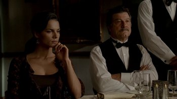 Movie still from “The Sopranos” (1999), created by David Chase – A man and a woman sitting at a dinner table; Medium shot, Over the shoulder angle