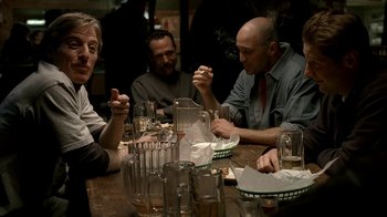 A group of people sitting at a table with drinks