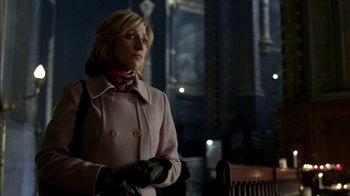Movie still from “The Sopranos” (1999), created by David Chase – A woman in a pink coat and black leather gloves; Medium shot, Low angle
