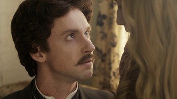 Movie still from “Anne with an E” (2017), created by Moira Walley-Beckett – A person with a mustache; Close Up shot, Over the shoulder angle