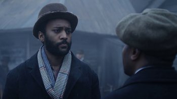 Movie still from “Anne with an E” (2017), created by Moira Walley-Beckett – A man wearing a hat and a coat; Close Up shot, Over the shoulder angle
