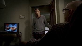 Movie still from “The Sopranos” (1999), created by David Chase – A man standing in front of a mirror in a room; Medium shot, Over the shoulder angle
