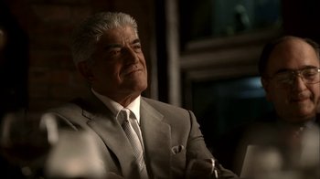 Movie still from “The Sopranos” (1999), created by David Chase – An older man wearing a suit and tie; Close Up shot, Over the shoulder angle