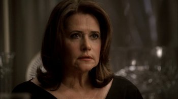 Movie still from “The Sopranos” (1999), created by David Chase – A person wearing a black shirt; Close Up shot, Over the shoulder angle