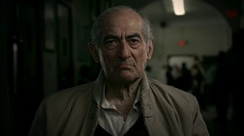 Movie still from “The Sopranos” (1999), created by David Chase – An old man with a beard and a jacket; Close Up shot, Low angle