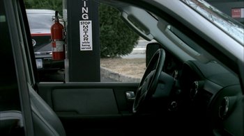 Movie still from “The Sopranos” (1999), created by David Chase – A view from inside of a car of the steering wheel; Medium shot, Over the shoulder angle