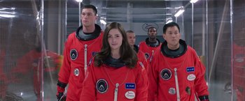Movie still from “The Space Between Us” (2017), directed by Peter Chelsom – A group of young people in red space suits; Medium shot, Over the shoulder angle