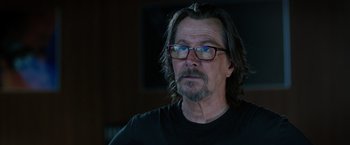 Movie still from “The Space Between Us” (2017), directed by Peter Chelsom – A person with long hair wearing glasses; Close Up shot, Over the shoulder angle