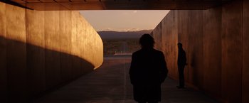 Movie still from “The Space Between Us” (2017), directed by Peter Chelsom – A person standing in a tunnel looking at a road; Extreme Wide shot, Over the shoulder angle